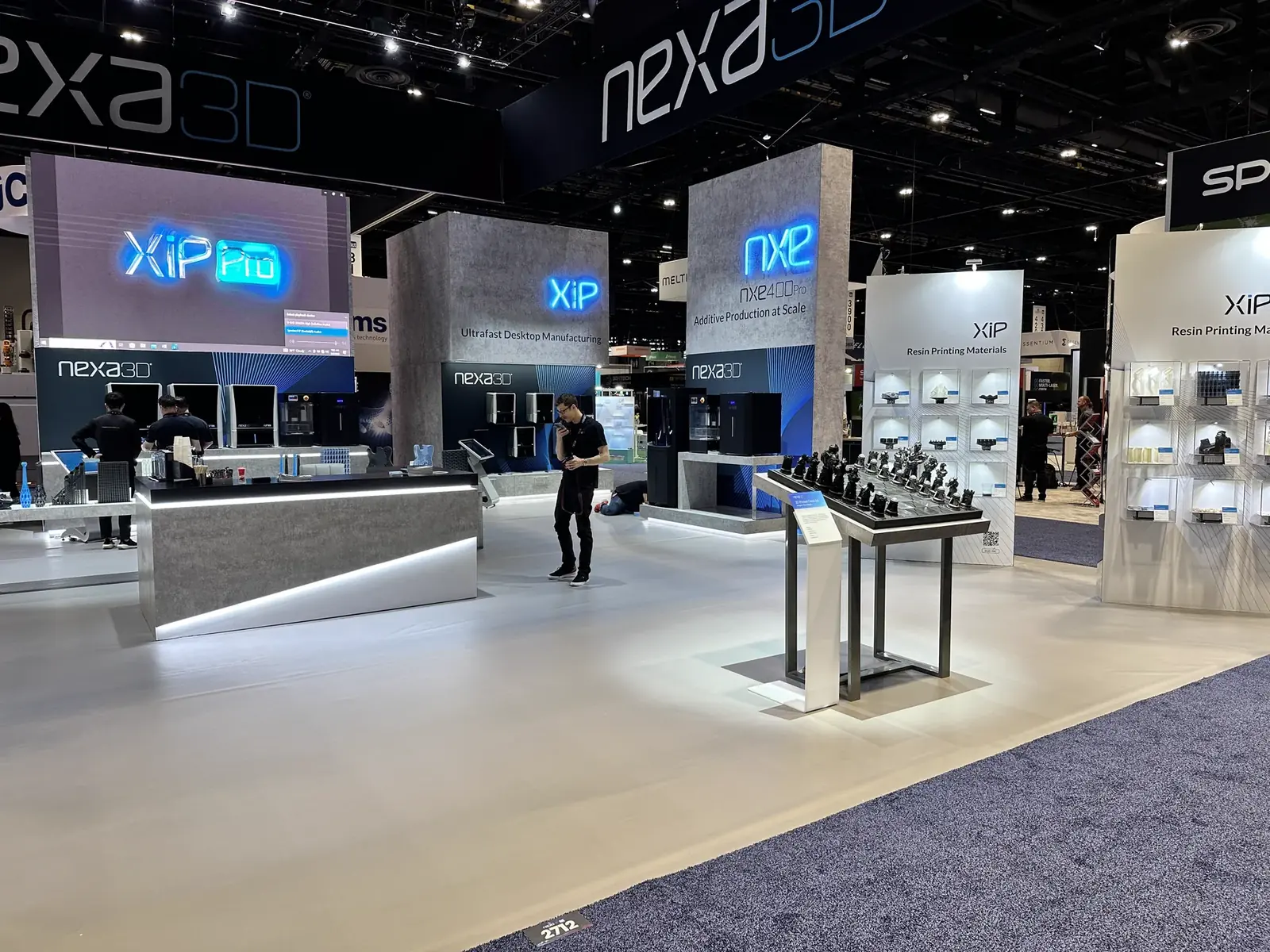 XiP and XiP Pro product towers on the Nexa3D exhibition stand at RAPID + TCT 2023 in Chicago