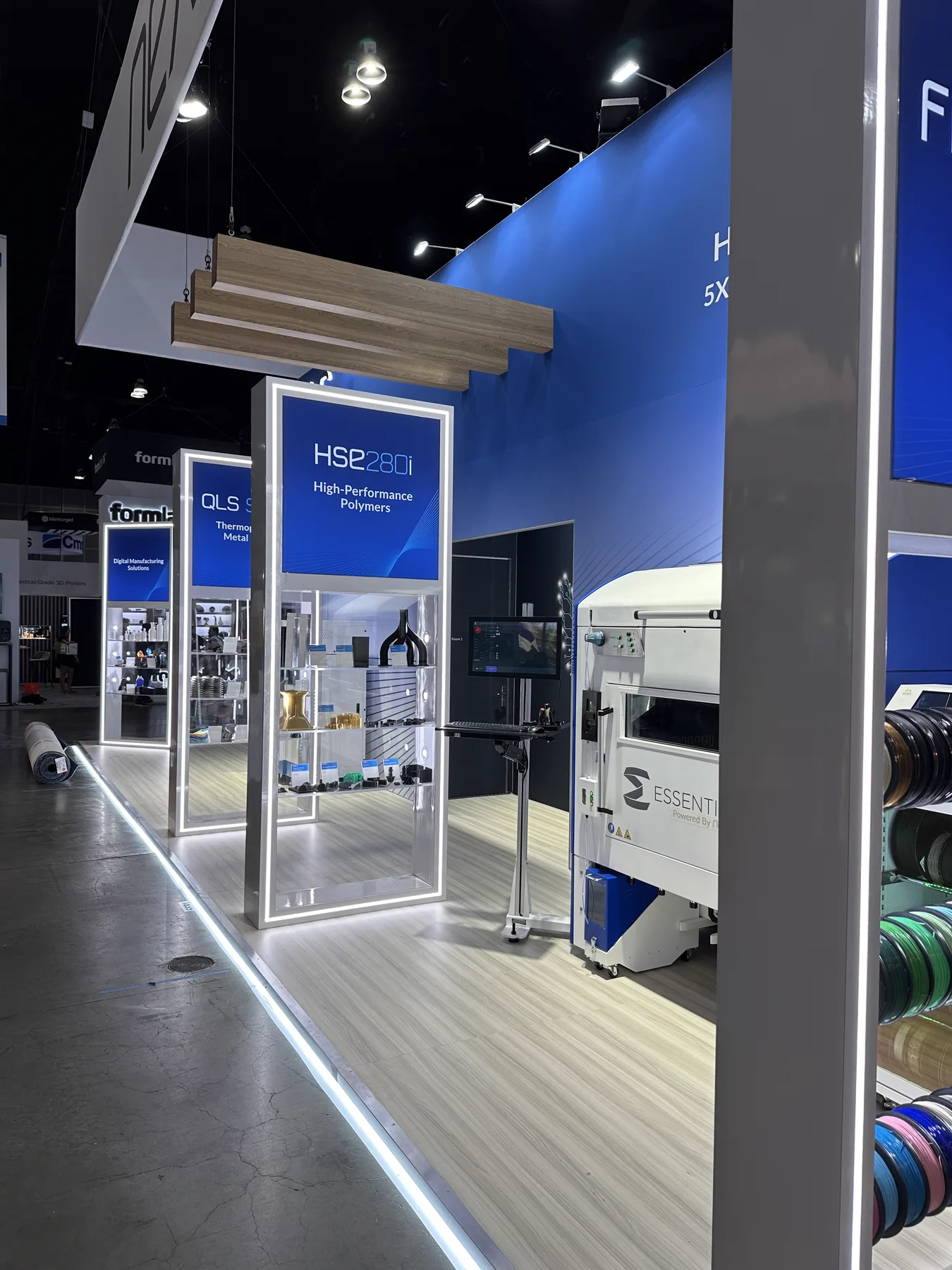Nexa3D exhibition stand at RAPID + TCT 2024 in Los Angeles, showing the HSE 280i high performance polymer printer